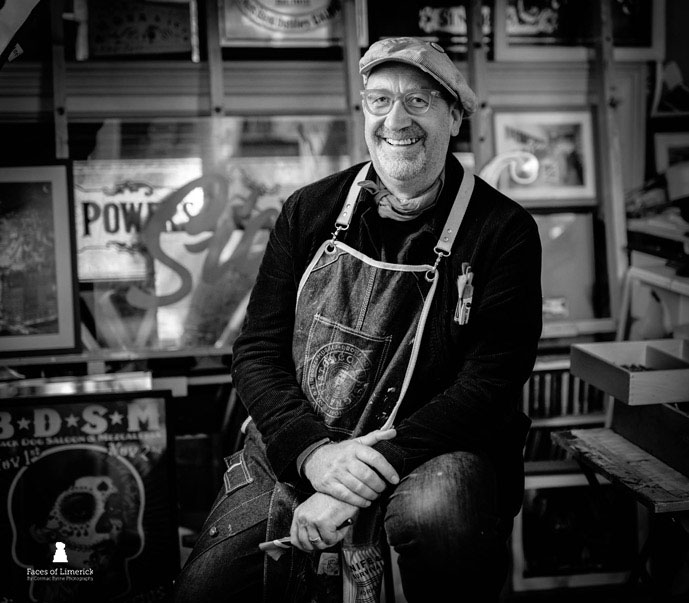 
A traditional sign writer based in Limerick City, Tom is celebrated for his craftsmanship and creative collaborations across art, film, and theatre. His hand-painted work brings character to cafés, bars, and businesses, and he has collaborated with artists including John Shinnors, Dorothy Cross, and Eoin Barry.Tom's artistry has featured in The Banshees of Inisherin and onstage in Mike Finn's Wreckquiem. A true craftsman, he continues to combine heritage, design, and heart in every project.


